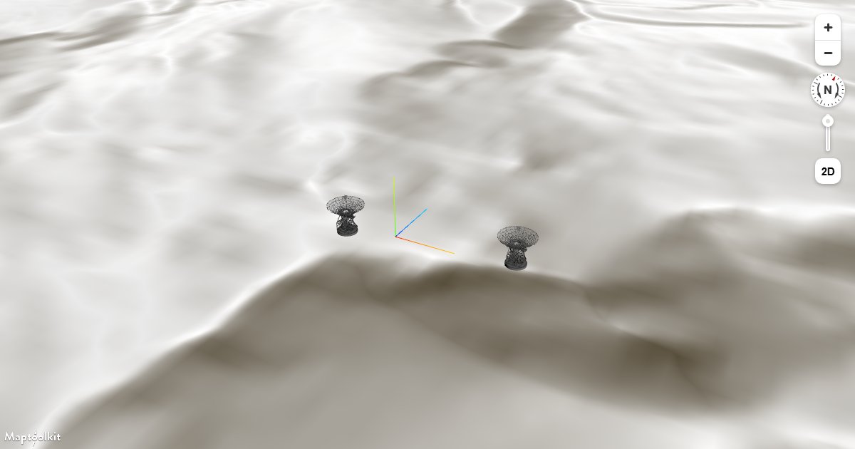 Place three.js GLTF models on a Maptoolkit map that has 3D terrain enabled, keeping models anchored to the elevated surface.